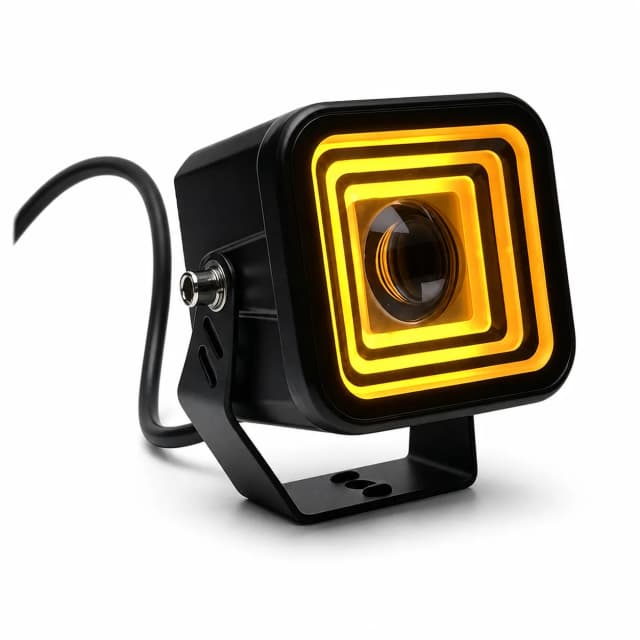 Amber motorcycle driving light on a clean white background