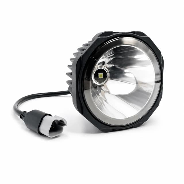 Round off-road vehicle spotlight on a clean white background